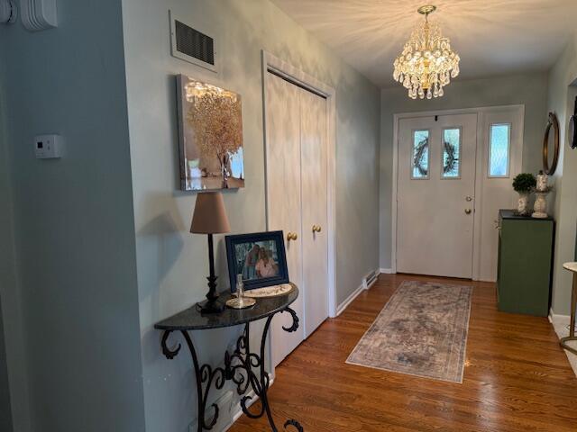 4005 86th Pl, Kenosha, WI 53142 - entryway with a chandelier and wood finished floors