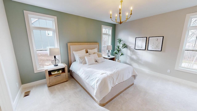213 W Fairview Dr, Menomonee Falls, WI 53051 - bedroom featuring a chandelier and light carpet