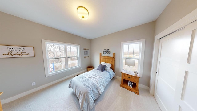 213 W Fairview Dr, Menomonee Falls, WI 53051 - bedroom with light colored carpet and multiple windows