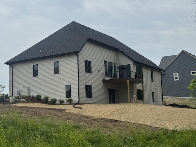 213 W Fairview Dr, Menomonee Falls, WI 53051 - rear view of house featuring a balcony