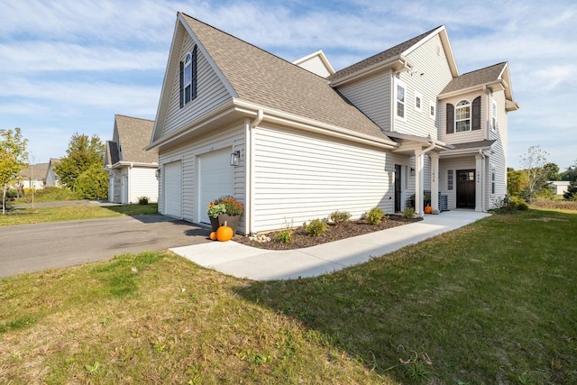 1887 Woodland Way, Slinger, WI 53086 - view of home's exterior featuring roof with shingles, an attached garage, a lawn, and driveway