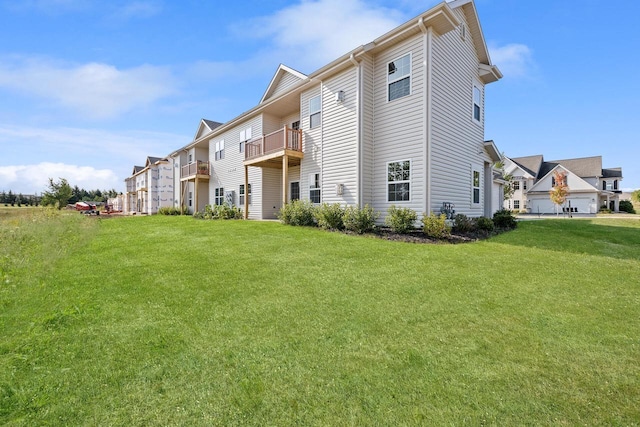 1887 Woodland Way, Slinger, WI 53086 - back of property with a balcony and a yard