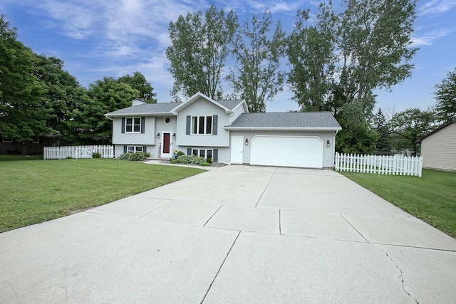 324 Nancy Ln, Pulaski, WI 54162 - split foyer home featuring an attached garage, driveway, and a chimney
