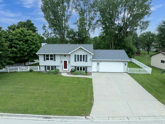 324 Nancy Ln, Pulaski, WI 54162 - bi-level home featuring an attached garage, a chimney, concrete driveway, and roof with shingles