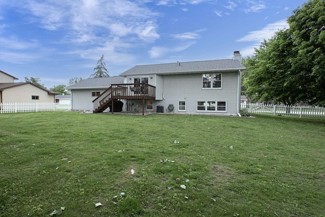 324 Nancy Ln, Pulaski, WI 54162 - rear view of house featuring stairway, a deck, a fenced backyard, and a chimney