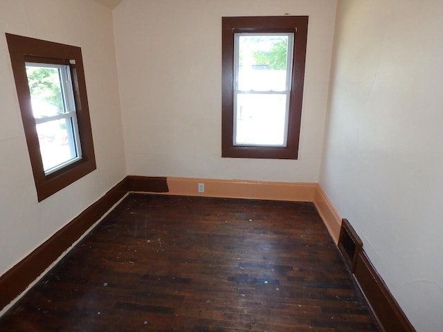 328 2nd St, Menasha, WI 54952 - unfurnished room featuring wood-type flooring and baseboards