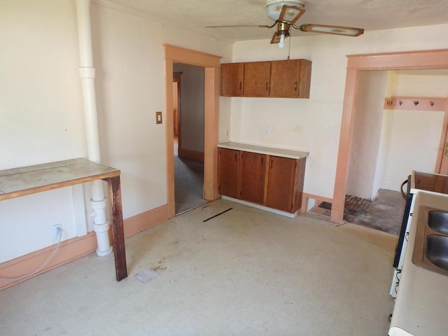 328 2nd St, Menasha, WI 54952 - kitchen with brown cabinets, ceiling fan, light countertops, and light floors