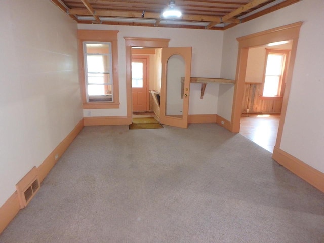 328 2nd St, Menasha, WI 54952 - spare room featuring light colored carpet and baseboards