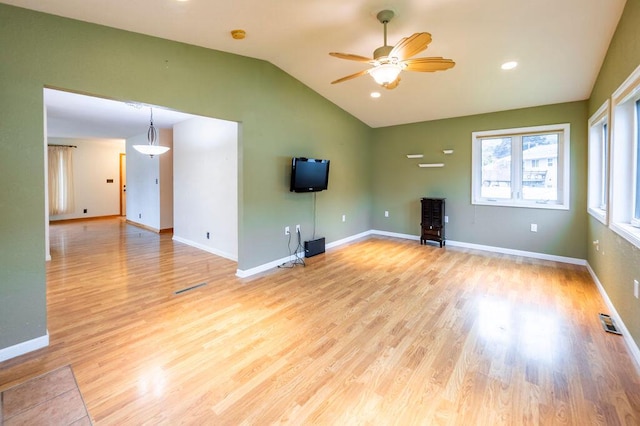 3424 Geneva Ln, La Crosse, WI 54601 - unfurnished living room featuring lofted ceiling, ceiling fan, and light wood-style flooring