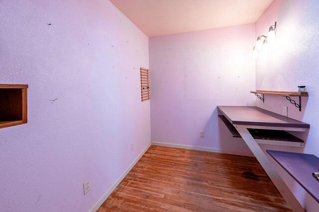 3424 Geneva Ln, La Crosse, WI 54601 - bathroom featuring wood finished floors and baseboards