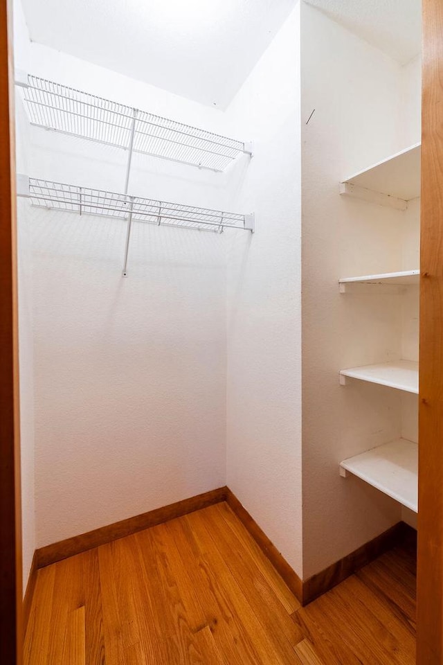 3424 Geneva Ln, La Crosse, WI 54601 - walk in closet featuring light wood-type flooring