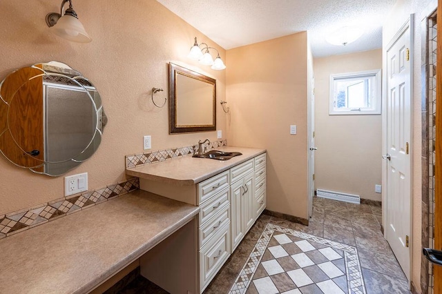 3424 Geneva Ln, La Crosse, WI 54601 - bathroom featuring vanity, a textured ceiling, and tile patterned floors