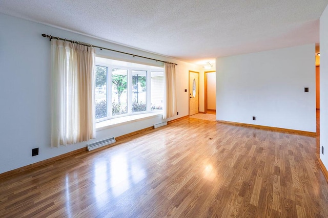 3424 Geneva Ln, La Crosse, WI 54601 - unfurnished room with wood finished floors and a textured ceiling