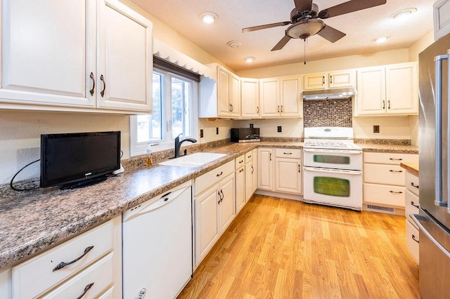 3424 Geneva Ln, La Crosse, WI 54601 - kitchen with white appliances, under cabinet range hood, light wood-style flooring, a ceiling fan, and white cabinetry