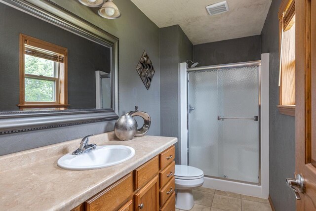 217 Lemongrass Way, Kaukauna, WI 54130 - bathroom featuring a shower stall, tile patterned floors, and vanity