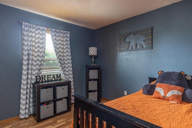 217 Lemongrass Way, Kaukauna, WI 54130 - bedroom featuring wood finished floors and baseboards