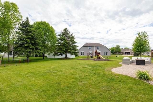 217 Lemongrass Way, Kaukauna, WI 54130 - view of green lawn with an outdoor living space, a playground, and a patio area