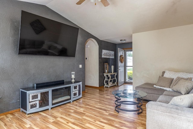 217 Lemongrass Way, Kaukauna, WI 54130 - living area featuring arched walkways, wood finished floors, ceiling fan, and lofted ceiling