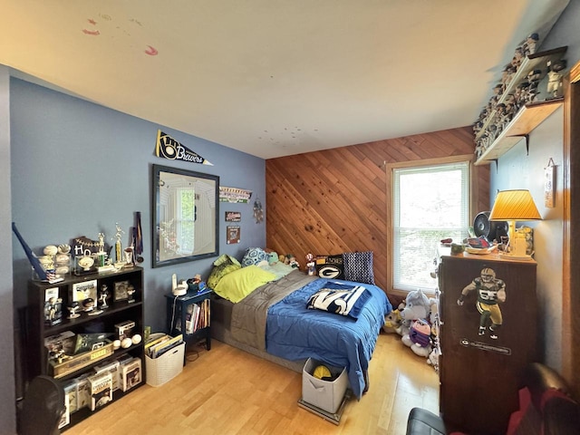 501 Hartridge Dr, Hartland, WI 53029 - bedroom featuring wooden walls and wood finished floors