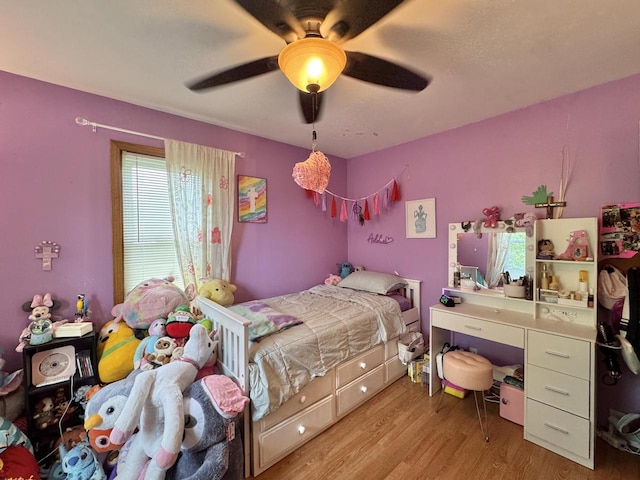 501 Hartridge Dr, Hartland, WI 53029 - bedroom with wood finished floors and a ceiling fan