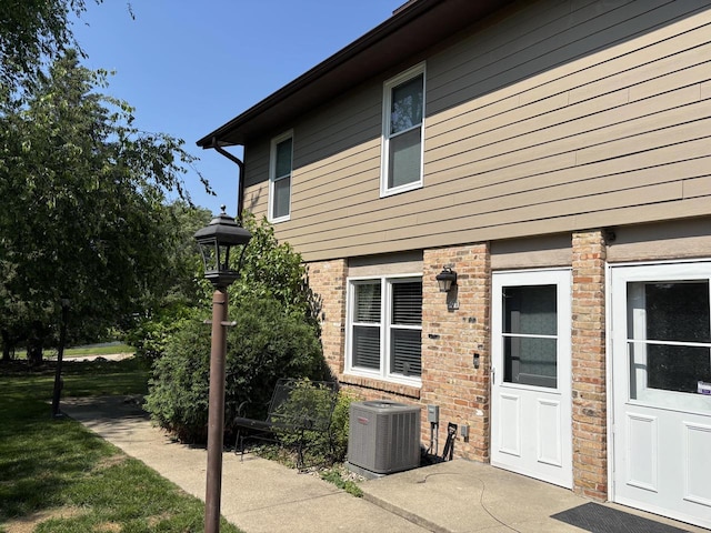 501 Hartridge Dr, Hartland, WI 53029 - rear view of property with brick siding