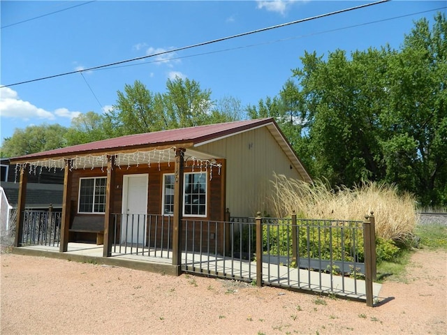 E150 Menonmonie St, Elk Mound, WI 54739 - view of front of home with a metal roof