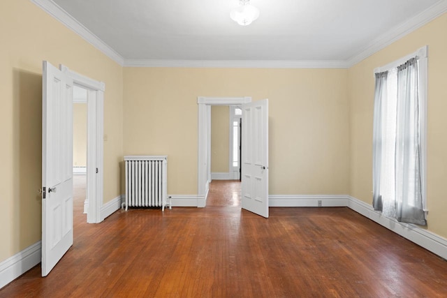 204 E Huron St, Berlin, WI 54923 - spare room with radiator heating unit, wood finished floors, and crown molding