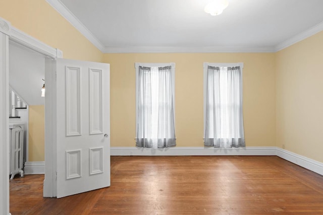 204 E Huron St, Berlin, WI 54923 - spare room with crown molding and wood finished floors