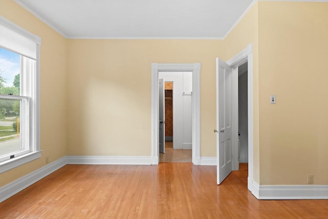 204 E Huron St, Berlin, WI 54923 - unfurnished bedroom with light wood-style floors and ornamental molding