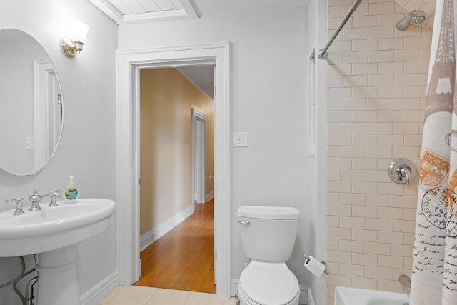 204 E Huron St, Berlin, WI 54923 - bathroom featuring wood finished floors and shower / tub combo