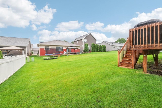 6017 Lyda Woods Ln, Madison, WI 53718 - view of yard featuring a gazebo, a trampoline, stairs, and a deck