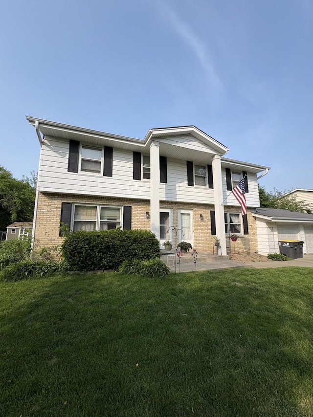 2712 Woodridge Ln, Waukesha, WI 53188 - view of front of property with brick siding and a front yard
