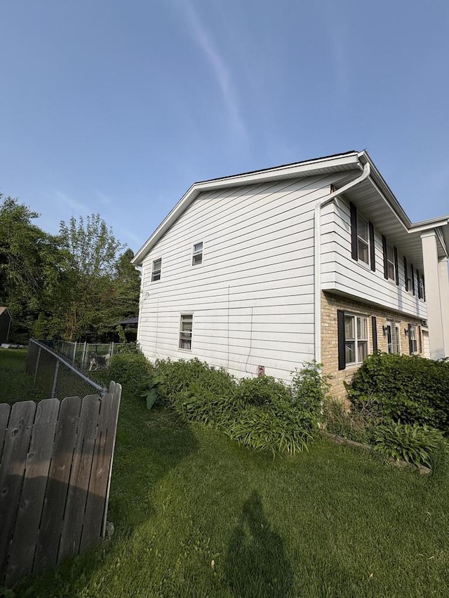 2712 Woodridge Ln, Waukesha, WI 53188 - view of side of home featuring brick siding