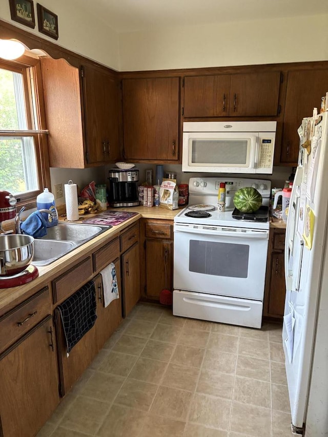 2712 Woodridge Ln, Waukesha, WI 53188 - kitchen featuring white appliances and light countertops