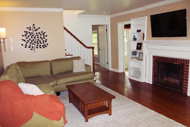 7008 N Rockledge Ave, Glendale, WI 53209 - living area featuring wood finished floors, stairway, crown molding, and a brick fireplace
