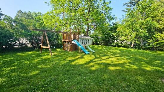 7008 N Rockledge Ave, Glendale, WI 53209 - view of jungle gym featuring a yard