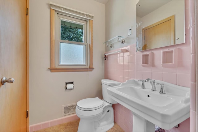 5542 W Jerelyn Pl, Milwaukee, WI 53219 - half bathroom with toilet and tile patterned floors