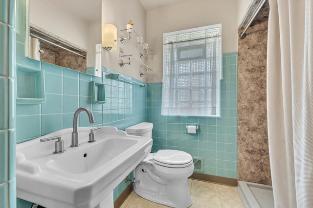 5542 W Jerelyn Pl, Milwaukee, WI 53219 - full bath with tile walls, a stall shower, tile patterned floors, and wainscoting