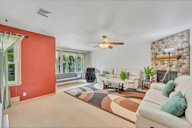 5542 W Jerelyn Pl, Milwaukee, WI 53219 - carpeted living room featuring ceiling fan and a fireplace