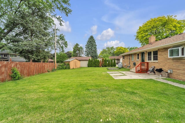 5542 W Jerelyn Pl, Milwaukee, WI 53219 - view of yard with a patio and a storage unit