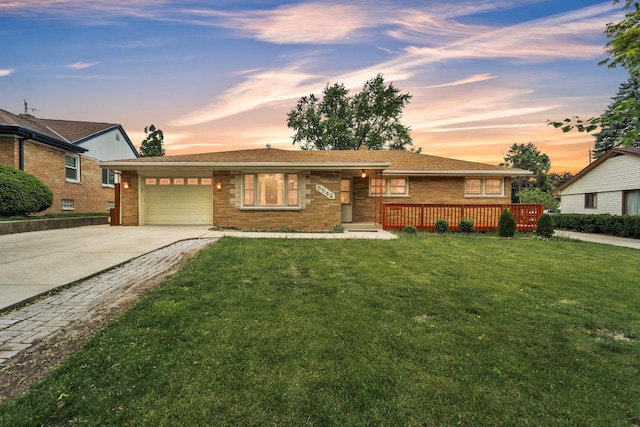 5542 W Jerelyn Pl, Milwaukee, WI 53219 - ranch-style home with an attached garage, driveway, brick siding, and a front lawn