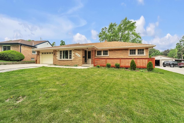5542 W Jerelyn Pl, Milwaukee, WI 53219 - single story home featuring driveway, an attached garage, brick siding, and a front lawn