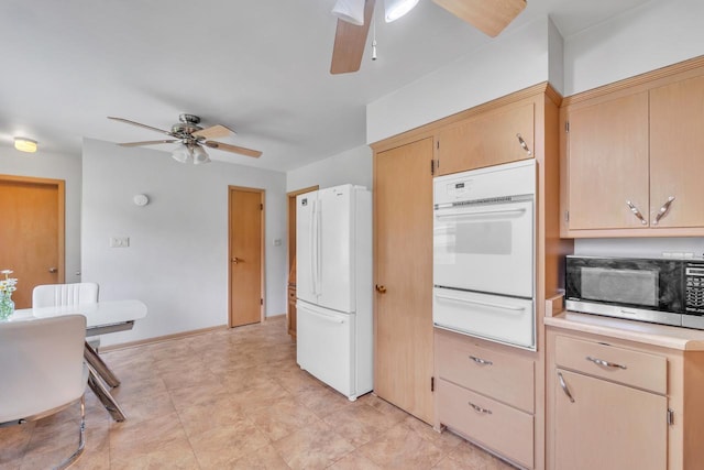 5542 W Jerelyn Pl, Milwaukee, WI 53219 - kitchen with white appliances, ceiling fan, a warming drawer, light countertops, and light brown cabinetry