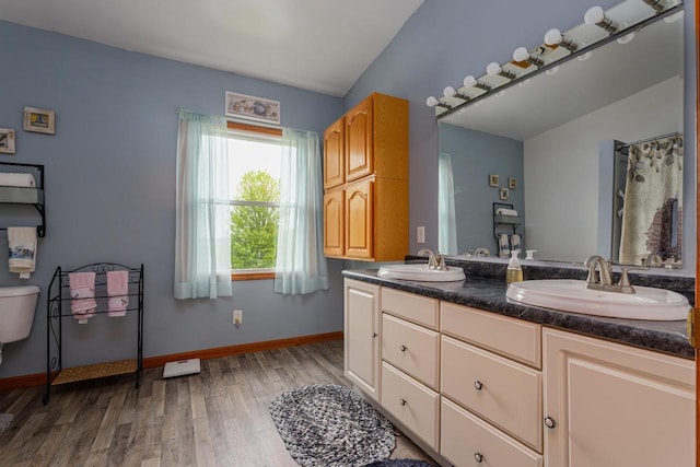 4114 Sheard Rd, Dover, WI 53139 - full bathroom featuring double vanity and wood finished floors