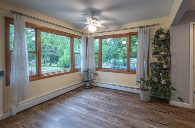 1718 N 13th St, Wausau, WI 54403 - empty room with ceiling fan, healthy amount of natural light, and a baseboard radiator