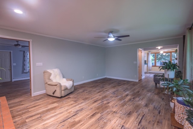 1718 N 13th St, Wausau, WI 54403 - unfurnished room featuring ceiling fan, wood finished floors, crown molding, and a baseboard heating unit