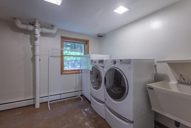 1718 N 13th St, Wausau, WI 54403 - washroom with washing machine and dryer and a baseboard heating unit