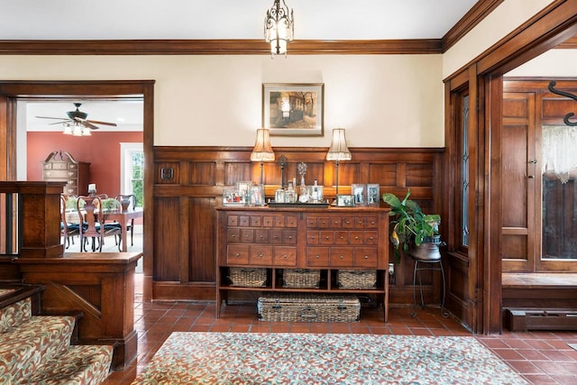 730 3rd St S, Wisconsin Rapids, WI 54494 - detailed view of ornamental molding, a ceiling fan, a baseboard heating unit, and wainscoting