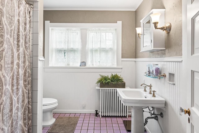 730 3rd St S, Wisconsin Rapids, WI 54494 - full bathroom featuring radiator, plenty of natural light, tile patterned flooring, a wainscoted wall, and ornamental molding