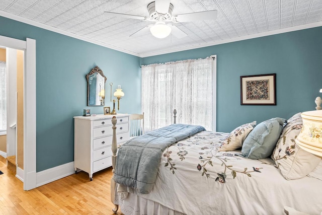 730 3rd St S, Wisconsin Rapids, WI 54494 - bedroom with light wood-style floors, crown molding, and ceiling fan